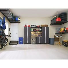 a garage filled with lots of different types of tools and equipment, including two bikes