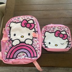 two children's backpacks with hello kitty on them