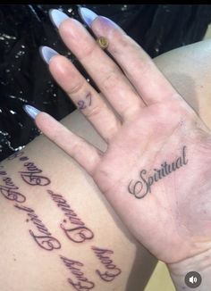 a woman's hand with writing on it