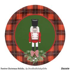 a red and black plaid christmas ornament with a nutcracker