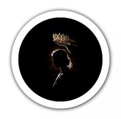 the silhouette of a woman with a crown on her head, against a black background