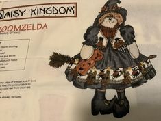 an image of a paper doll made to look like a witch