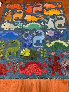 a child's rug with dinosaurs and numbers on it