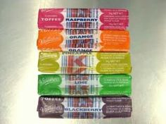 five bars of fruit flavored candy are stacked on top of each other