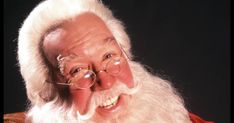 an old man wearing glasses and a santa clause wig is making a funny face with bubble gums on his nose