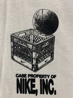 a t - shirt with the words case property of nike, inc and an image of a basketball in a basket