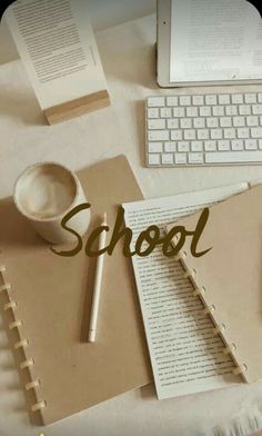 an image of a school desk with books and notebooks on it that says school