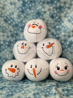 six snowmen made out of balls sitting on top of each other