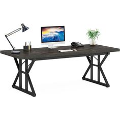 a computer desk with a monitor, keyboard and mouse on it in front of a white background