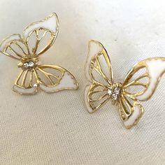 This Is A Pair Of Fashion Jewelry Earrings Gold White Enamel Butterflies Approx 1 Inch Please Contact Me With Any Questions White Butterfly Charm Earrings As Gift, Elegant White Earrings With Butterfly Charm, Elegant White Butterfly Charm Earrings, White Butterfly Charm Earrings For Wedding, White Butterfly Charm Earrings, White Butterfly-shaped Earrings With Butterfly Charm, Jewelry Earrings Gold, Gold Jewelry Earrings, Fashion Jewelry Earrings