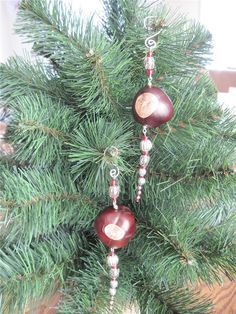 a christmas tree with ornaments hanging from it's branches