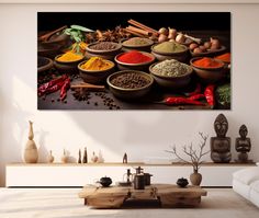 an assortment of spices and herbs in bowls on a table