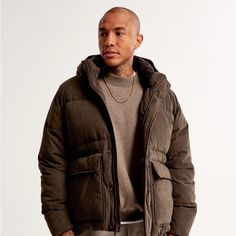 Our New Heavyweight Puffer Jacket In A Sueded Nylon Fabric With Wind- And Water-Resistant Properties, Featuring Recycled Fill To Protect Against The Elements, Front Pockets With Flap Closure, Interior Chest Pocket, Zip- And Snap-Up Front, Functional Hood, Mock Neck Collar, Drop-Tail Hem And Elastic Cuffs. Imported. Shell:57% Composite Fiber Polyester/ Nylon, 43% Polyester / Lining:100% Polyester / Filling:100% Recycled Polyester Fibers Machine Wash Cold, With Like Colors Only Non-Chlorine Bleach Neck Collar, Abercrombie Fitch, Chest Pocket, Tumble Dryer, Mens Jackets, Puffer, Jackets & Coats