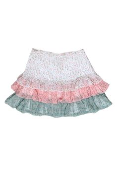 Show off your passion for petals and cottagecore style in this adorable skirt from Divine Heritage! The floral print and ruffle design of this skirt is perfect for a spring outing or even for your Easter brunch outfit! Wear it with a pastel tank and a jean jacket for a fresh and flouncy look. Size S 100% Polyester Fully lined Concealed side seam zipper closure Faux buttons at front Waist 24" Hip 30" Total length 15.5" Tiered Ruffle Skirt For Garden Party, Cute Ruffled Mini Skirt For Spring, Feminine Ruffle Hem Skirt For Garden Party, Summer Garden Party Skirt With Ruffle Hem, Cute White Floral Print Skirt, Ruffled Tiered Skirt For Garden Party, Ruffled Bottoms For Spring Garden Party, Ruffled Bottoms For Garden Party In Spring, Tiered Skirt With Ruffles For Garden Party