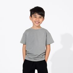 Elevate their wardrobe with our Stormy Grey Bamboo Terry Daywear Kids T-Shirt. Soft, cozy, and effortlessly cool, this tee is perfect for playdates or lounging at home. Made from sustainable bamboo fabric, it's gentle on the skin and the planet. Add a touch of sophistication to their ensemble with Stormy Grey! Versatile and Stylish: Perfect for both indoor and outdoor activities, this versatile tee pairs effortlessly with jeans, shorts, or joggers for a stylish look. Breathable and Moisture-Wick Casual Crew Neck T-shirt For Playwear, Casual Relaxed Fit Tops For Playwear, Basic Cotton T-shirt For Playwear, Relaxed Fit Short Sleeve T-shirt For Playwear, Relaxed Fit Cotton T-shirt For Playwear, Casual Solid Color T-shirt For Loungewear, Casual Gray T-shirt For Loungewear, Casual Solid T-shirt For Loungewear, Gray Family Matching Short Sleeve Tops