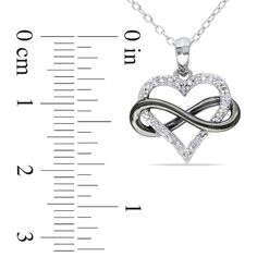 This charming diamond pendant is a meaningful way to say, "My heart is forever yours." Crafted in sleek sterling silver, this design pairs an outlined heart, lined with shimmering diamonds, with a looping infinity symbol, finished with bold black rhodium plating. Locked in an everlasting embrace, this 1/10 ct. t.w. diamond pendant is polished to a brilliant shine and suspends along an 18.0-inch cable chain that secures with a spring-ring clasp. Silver Infinity Heart Necklace For Anniversary, Sterling Silver Infinity Heart Necklace For Anniversary, Infinity Heart, Peoples Jewellers, Infinity Symbol, Forever Yours, Black Rhodium, Bold Black, Cable Chain