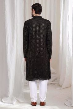 Black cotton kurta with sequin work embroidery. Paired with solid churidaar. - Aza Fashions Party Wear Kurta With Mirror Work, Party Wear Long Sleeve Kurta With Mirror Work, Long Sleeve Party Wear Kurta With Mirror Work, Party Wear Straight Kurta With Mirror Work, Embroidered Straight Kurta For Party, Party Wear Embroidered Straight Kurta, Embroidered Party Wear Kurta With Traditional Drape, Party Wear Kurta With Resham Embroidery For Festivals, Festive Party Wear Kurta With Zari Work