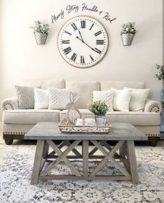 a living room filled with furniture and a large clock on the wall above it's coffee table