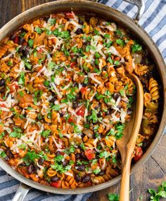 a large pot filled with lots of food on top of a table