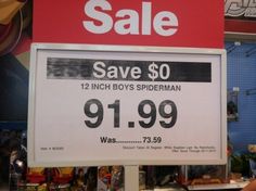 a sale sign for boys's shoes in a store