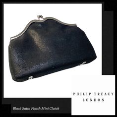 Color: Black Material: Satin Finish Fabric, Gunmetal Silvertone Hardware Size: 7in L X 3.5 On The Short Side To 4.5in On The High Side H X 1.5in W Condition: Bnib. Bought, Never Used In The End. Sat In Storage. Come With Original Box. Simple Elegant Mini Clutch From Philip Treacy London, Featured In Black Satin Finish Fabric, With Twist Lock Closure In Gunmetal Silvertone Hardware. -Mini Clutch Style -Twist Lock Closure -Philip Treacy London Logo Plaque In The Interior -Signature Feather Print L Designer Black Evening Bag With Silver-tone Hardware, Designer Black Evening Bag For Party, Designer Black Evening Bag For Events, Elegant Black Clutch With Silver-tone Hardware, Designer Black Clutch For Events, Designer Black Evening Bag For Night Out, Chic Black Clutch With Silver-tone Hardware, Designer Black Clutch For Party, Black Leather Evening Bag For Events