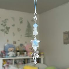 a wind chime hanging from the ceiling in a bedroom