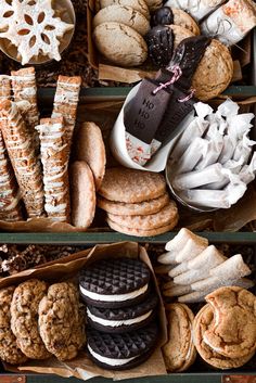 an assortment of cookies and pastries in boxes