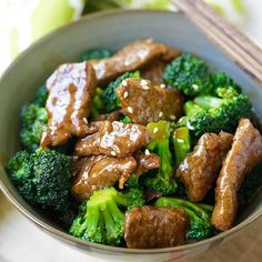 beef and broccoli in a bowl with chopsticks