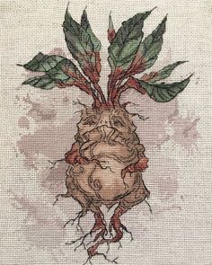 a cross stitched picture of a broccoli plant with green leaves on it