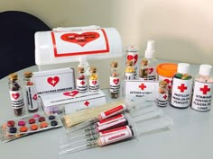 an assortment of medical supplies sitting on top of a white table next to each other