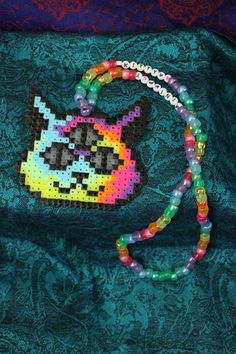 a beaded purse with a cat on it