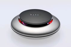 an electronic device with the word htc on it's back side and red light at the top