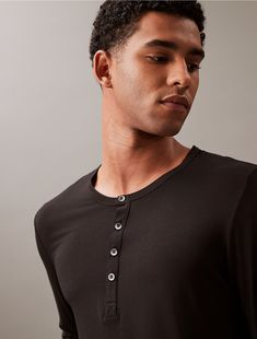 Breathable ultrasoft modal stretch. Crafted with a super soft hand, this Calvin Klein henley t-shirt is designed with a crewneck, a fitted body and button closures at the neckline.  Material: 87% Modal, 13% Elastane. Henley T Shirt, Modern Lounge, Soft Hands, Soft Hand, Calvin Klein, Lounge, T-shirt, Crew Neck, T Shirt