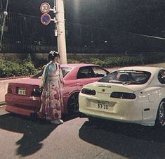 two cars parked next to each other on the street