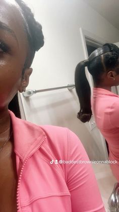 a woman in a pink shirt is brushing her teeth