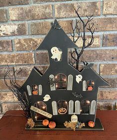 a halloween house with pumpkins and ghost decorations