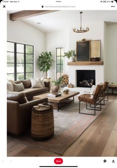 a living room filled with furniture and a fire place in the middle of a room