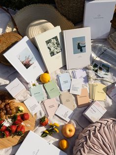 the table is covered with cards and fruit