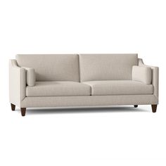 an image of a couch that is in the middle of a white background with wood legs