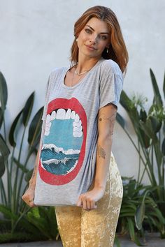 FREE SHIPPING ON ORDERS OVER $60 Let your style sail to new heights with the Ocean Mouth Camden Tee! Featuring a vintage-inspired graphic, a scoop neck, and a relaxed fit, this super soft tee is the perfect way to make a splash! Don't miss the boat - sail away in style! Color: Heather Grey Fabric: Rayon Spandex Model wears a Medium Tumble dry on low Relaxed Fit Graphic Tee With Scoop Neck, Summer Scoop Neck Top With Graphic Print, Summer Graphic Tee With Scoop Neck, Casual Soft-washed T-shirt With Scoop Neck, Casual Graphic Print Scoop Neck Top, Trendy Scoop Neck Top With Graphic Print, Wild And Free, The Boat, Dress Romper