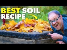 a man pointing at leaves that are on top of a wooden box with the words best soil recipe