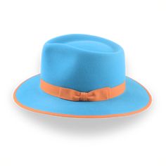 Description Materials Craftsmanship Hat Care Shipping Returns Product Description h2 { font-weight: lighter; } h3 { font-weight: lighter; padding-top:15px; } strong { font-weight: lighter; } Customizable Sky Blue Fedora Options Elevate your style with the Equinox, a sky blue fedora that blends vibrant color with sophisticated craftsmanship. Made from luxurious rabbit fur felt, this hat features a smooth finish, a teardrop crown, and a wide brim, ensuring both comfort and elegance. Fully customiz Homburg Hat, Outdoor Hut, Gambler Hat, The Raid, Mens Hats Fashion, Fedora Hat Men, Why Do Men, Grey Fur, Homburg