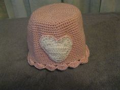 I made this cute hat from silky soft, warm Caron Simply Soft yarn in soft pink and white. Pink Hat with White Heart Measures 24" around band x 7" from crown to brim, about a size medium Warm and Toasty Makes a great gift for someone special! Excellent stocking stuffer or teacher gift! Perfect for teen or tween Machine wash and dry I am happy to ship worldwide.  Please request an international shipping quote.  If any shipping quote is more than $1.00 over the actual shipping, I will refund the difference. My home is smoke-free and pet-friendly.         Please email any questions. Cute Pink Crochet Beanie Hat, Cute Pink Crochet Beanie, Cute Pink Bonnet With Curved Brim, Cute Handmade Pink Bonnet, Handmade Cute Pink Bonnet, Cute Pink Crochet Hat, Pink Beanie Mini Hat For Spring, Handmade Pink Crochet Hat As Gift, Adjustable Pink Crochet Hat As Gift