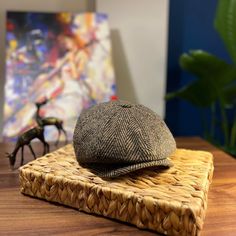 a brown hat sitting on top of a wooden table next to a horse figurine