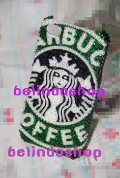 a cell phone case with the words starbucks on it and a green glittered logo