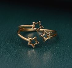 "Open Star Ring, Star Stacking Ring, Minimalist Dainty Ring, Thin Knuckle Ring, Midi Ring, Celestial Ring, Tiny Star Ring, Triple Star Ring Size:- All Size Available In Variation Metal:-Brass IMPORTANT NOTE....👇 1 product free gift on purchase of 3 products. You can choose the free gift as your wish. Take a screenshot of the free gift you like from my shop and send me a photo in personal message. MUST READ....👇 5 stars is my shop's priority. So contact me before leaving any negative review. I Golden Star Jewelry, Space Aesthetic Accessories, Star Assesories, Cute Small Rings, Star Ring Aesthetic, Gold Star Accessories, Gold Celestial Jewelry, Adjustable Gold Star-shaped Rings, Adjustable Gold Star Ring