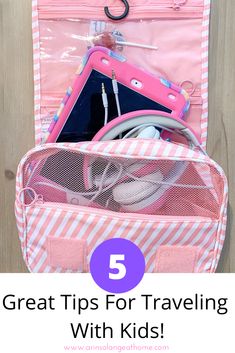 an open pink suitcase with headphones in it and the words 5 great tips for traveling with kids