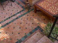 an overhead view of a patio with stairs and tables