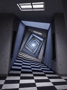 an empty hallway with black and white checkered flooring in the center is lit by two skylights