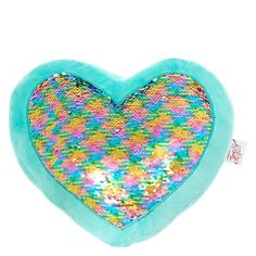 a blue heart shaped pillow with colorful sequins